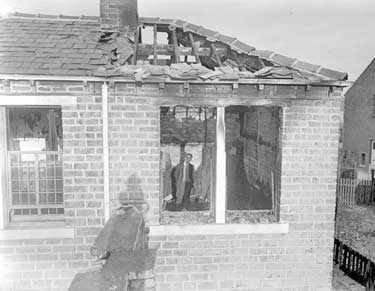 Mr A Tetley in his fire destroyed house at Quarmby Road, Longwood 	