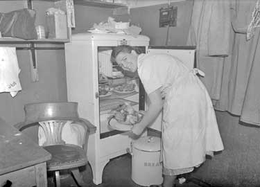 Woman in kitchen 	