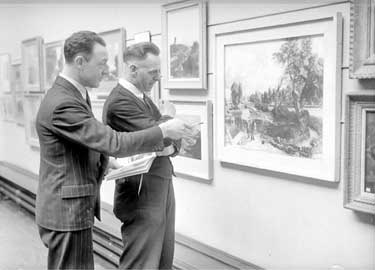 Brighouse Library, Messrs Bailey and Wardle looking at paintings 	