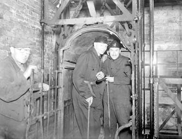 Lord Saville and Canon Woods with Miners at Emley Pit 	