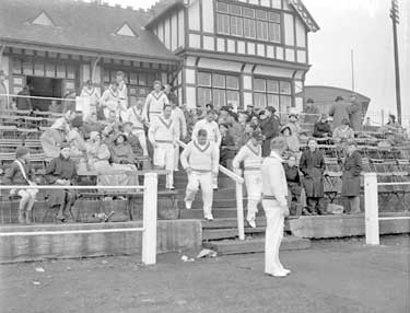 Cricket players coming out, Fartown 	