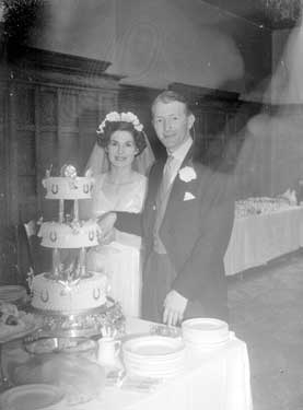Sykes/Perkins wedding (cutting cake) 	