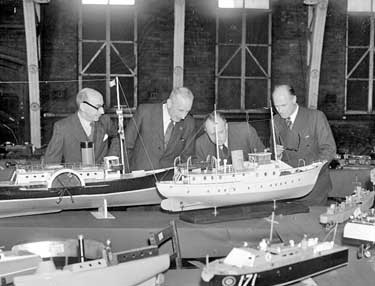 Model Engineers with model ships 	