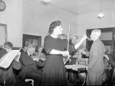 County orchestra at Kirkheaton School. Miss Ella Tomlinson playing violin 	