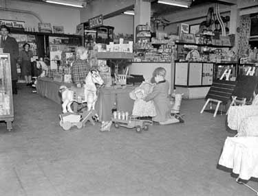 Children in Rushworths toy department 	