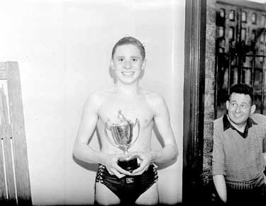 Swimmer with trophy 	