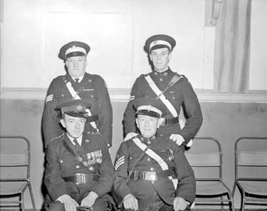 Four men in uniform 	