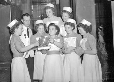 Nurses prizegiving - group of award winners and cup 	