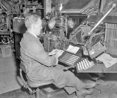 Man using printing machine 	