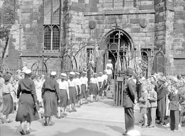 Girl Guides Parade going into St Peter's Church, Huddersfield 	