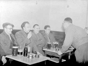 Group of men in public house 	