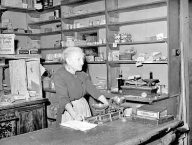 Mrs E Stead, 89 year old shopkeeper at Cowcliffe, Huddersfield 	
