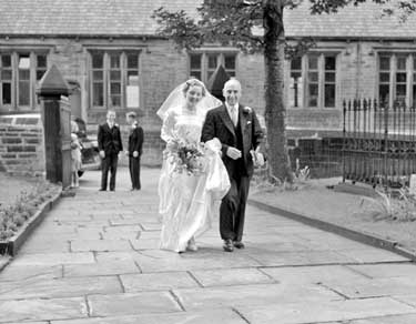 Hollingworth/Turton wedding, New Mill, Huddersfield. Bride arriving at church 	