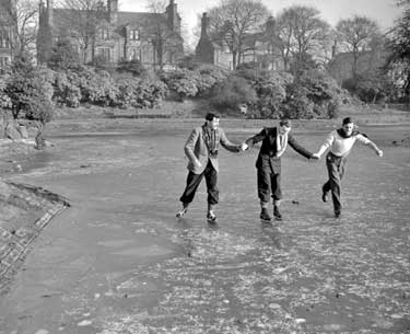 Skating on frozen lake in Greenhead Park, Huddersfield 	
