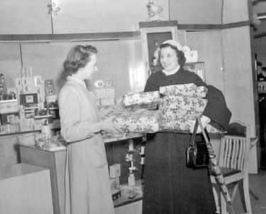 Judy Kemp with christmas parcels at Rushworth's 	