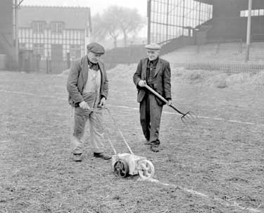 Groundsmen, C.Cusworth with line marker and R.Lewis with fork 	