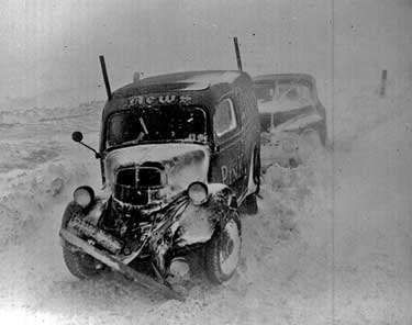 Vehicles stuck in snow 	