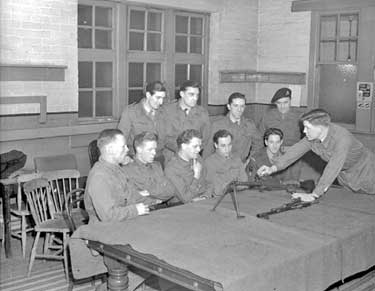 Milnsbridge Drill Hall, Territorial Army receiving gun instruction 	