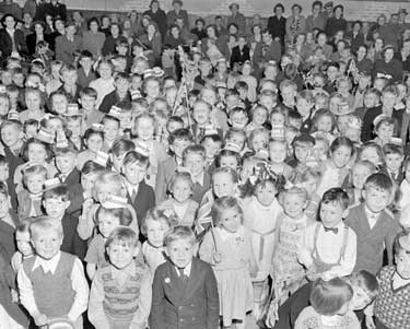 Large group of children celebrating the Coronation 	