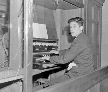 Adrian Beaumont playing the organ at Kirkburton Church 	