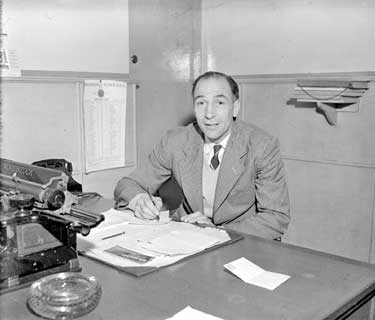 Eddie Bolt, Town Manager in his Office. 	