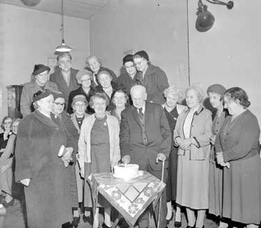 Joe Swift aged 95, cuts cake at Derby and Joan Club 	