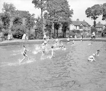 Children in paddling pool, park, Huddersfield 	