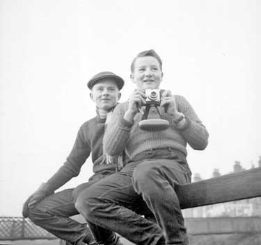 Two boys with camera 	