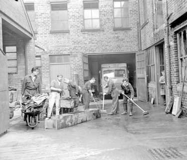 Cleaning up after fire at William Street, Huddersfield 	