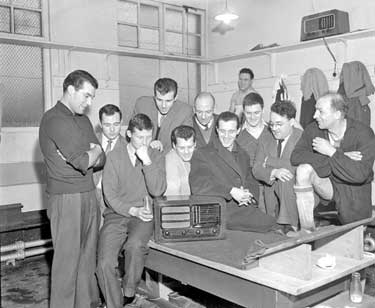 Huddersfield Town players listening to FA cup 4th round draw 	