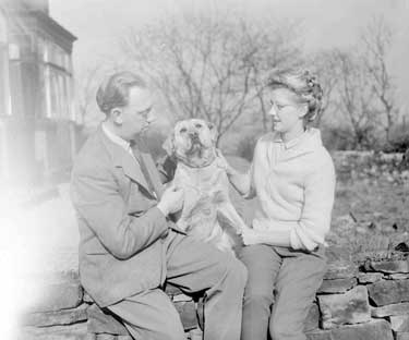 Mr and Mrs J Tempest with their dog, Sandra 	