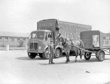 Hansons horse and cart next to Hansons lorry 	
