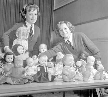 Newsome County Secondary School, girls with dolls 	