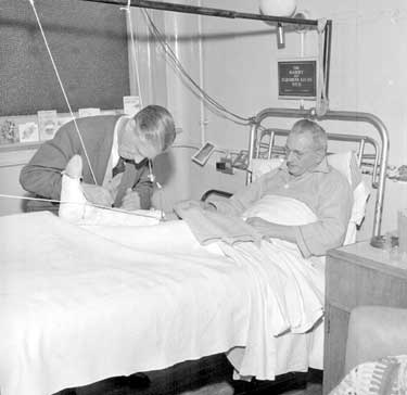 Donald Wade at Huddersfield Royal Infirmary, autographing plaster cast 	