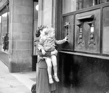 Woman and child outside Post Office 	
