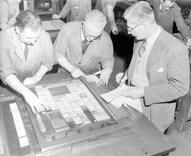 Linotype Machine, Examiner Newspaper - before this date the first page contained only advertisments. Maurice Bentley (Deputy Overseer), George Chadwick (Overseer) and Bill Lowis (Chief Sub-editor) prepare the first front page to contain news stories. 	
