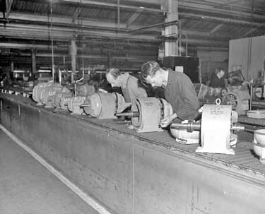Empress Works of Brook Motors - these electrical motors were destined for America. Mr N Lindley (left) and Mr J Cain are seen working on the conveyor belt. 	
