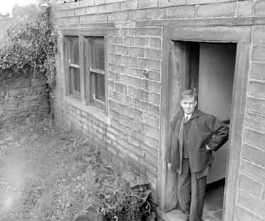 Mr Scott at door of his ú25 Paddock House 	