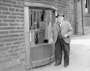 Mr Helliwell outside stake and bow window at Brighouse 	