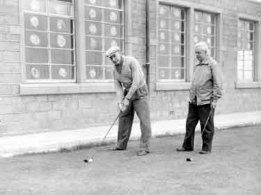 Men playing golf, Crosland Moor 	