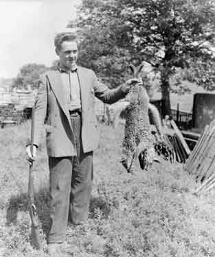 Mr J Clayton with two dead foxes at Netherall Farm, Rawthorpe, Huddersfield 	