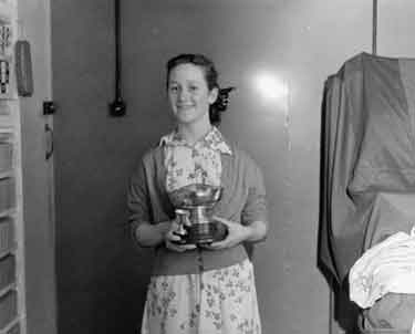 Anne Berry, schoolgirl swimming champion with cups 	