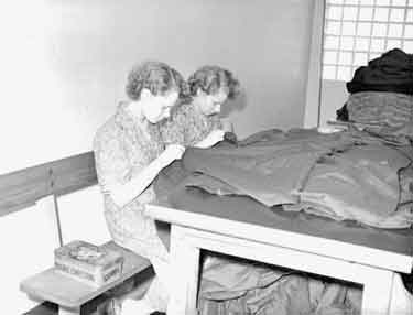 Girls sewing 	