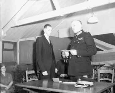 Mr D T Wilkinson receives British Empire from Lord Scarborough 	