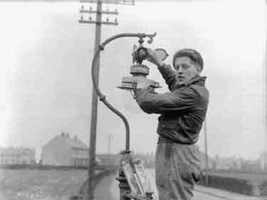 Men replacing lamps in Kirkburton, Huddersfield 	
