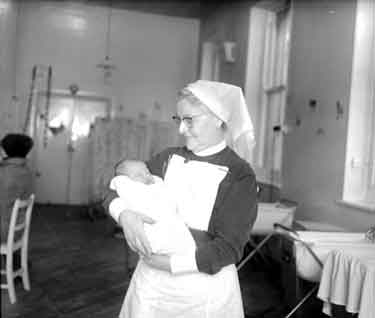 Sister Lilley with baby, St Luke's Hospital 	