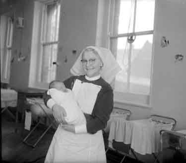 Sister Lilley with baby, St Luke's Hospital 	