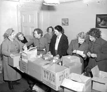 Ladies Circle packing parcels for the elderly 	