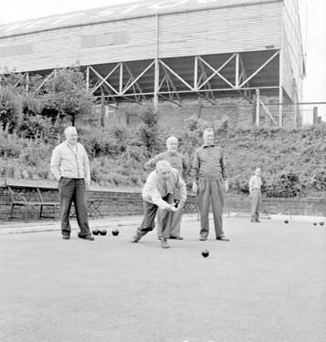 Playing bowls in Working Men's Club 	