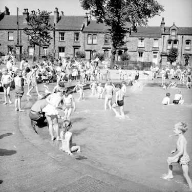 Children paddling at Greenhead Park, Huddersfield 	